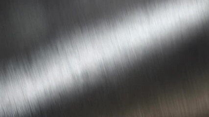 Poster - Textured silver brushed metal surface with diagonal lines capturing light and shadows in metallic grey tone, industrial aesthetic background.
