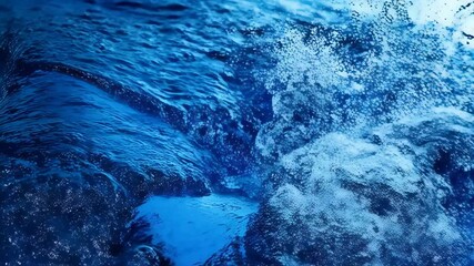 Poster - Close-up video of water splashing with droplets and blue waves creating a dynamic and refreshing visual effect.