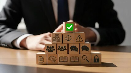 Aufkleber - Man in suit placing checkmark block atop pyramid of wooden blocks with various business icons on them