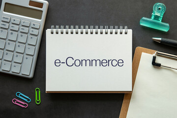 Poster - there is notebook with the word e-commerce. it is as an eye-catching image.