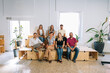 © Manu Padilla/Stocksy - Startup team members sitting together in their workspace
