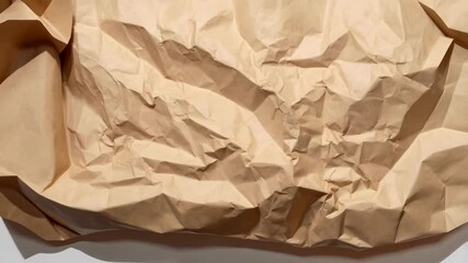 Poster - Close-up shot of heavily crumpled brown craft paper with visible creases and texture detail for art or packaging use