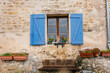 © Addie Mannan Photography/Stocksy - Blue shutters