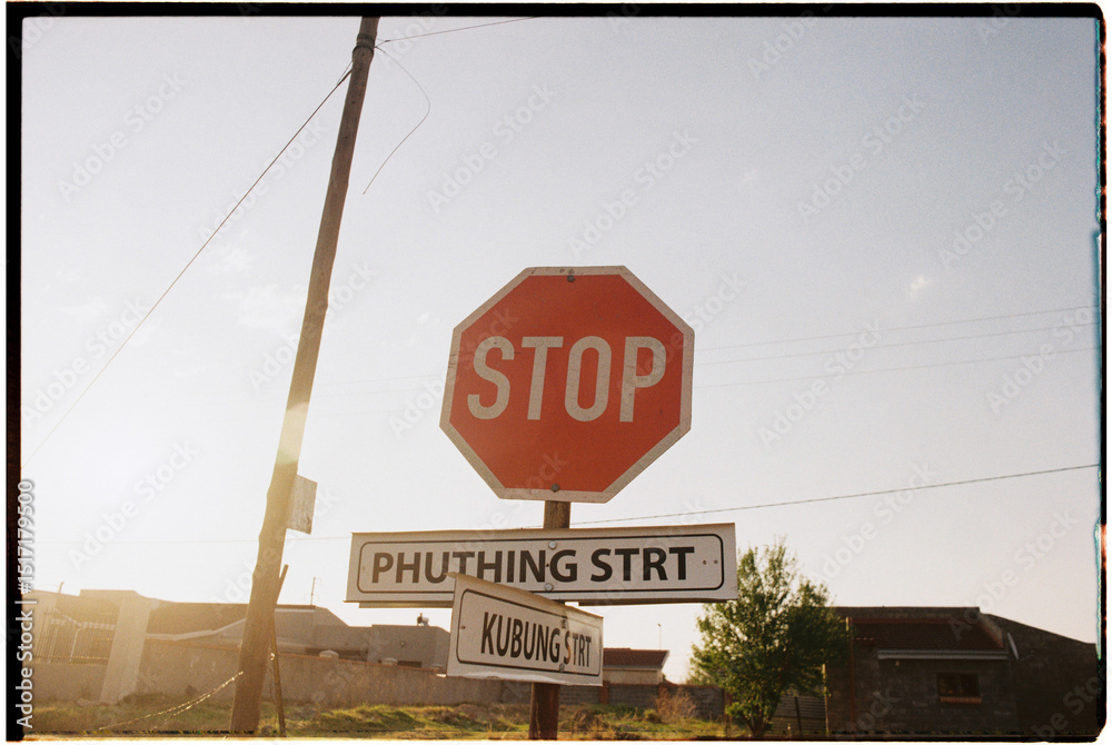 Stop Sign Names Backlit photo of stop sign with street names Stock Photo | Adobe Stock