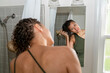 © Christine La/Stocksy - blow drying curly hair