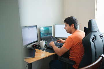 Latin man sitting at his home office desk