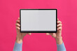 © Sibila and Pavel/Stocksy - Person holding modern tablet with blank screen. Mock-up.
