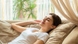 © Zhang - Young woman sleeping peacefully on cozy couch, enjoying rest and relaxation at home, comfort and wellbeing lifestyle concept for wellness and self care