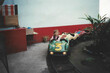 © María Soledad Kubat/Stocksy - 90s childhood fun – girl driving a go-kart