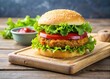 © udomsak - Crunchy veggie burger patty topped with fresh lettuce leaves and a dollop of ketchup on a modern wooden cutting board