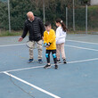© Inna Reznik/Stocksy - Tennis Lesson With Grandfather And Kids