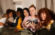 © VICTOR TORRES/Stocksy - Friends enjoying a cozy group selfie together