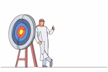 Poster - Continuous one line drawing Arabian businessman or manager is standing or leaning the target with thumbs up gesture. Arrow hit the target exactly. Single line draw design vector graphic illustration