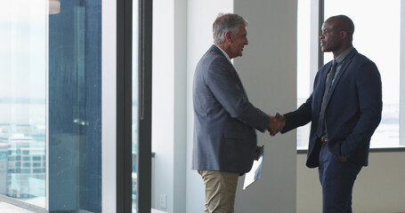 Poster - Contract, handshake and meeting with business people in office for welcome, deal and thank you. Partnership, shaking hands and B2B with employees in agency for teamwork, support and opportunity