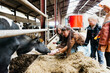 © Melissa Milis Photography/Stocksy - children feeding a cow on farm visit, engaging with nature