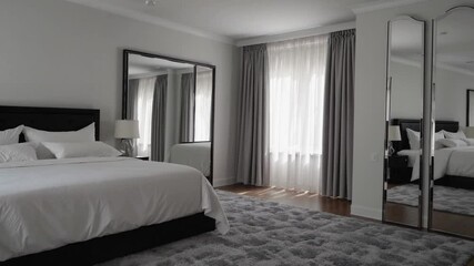 Poster - Modern bedroom elegance with simple decor, large mirror, and soft rug create calm, inviting atmosphere and modern bedroom