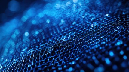 Abstract close-up of blue mesh texture with bokeh effect