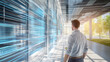 © LorelEino - Man Observing Futuristic Data Streams in a Modern Corridor