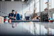 © Westend61 - Engineer and craftsman discussing a project in a workshop