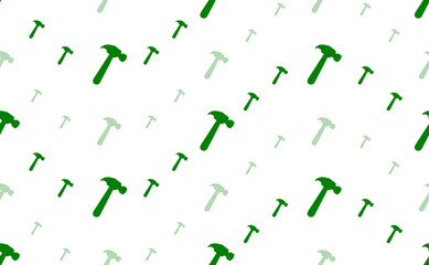 Poster - Seamless pattern of large and small green hammer symbols. The elements are arranged in a wavy. Illustration on light green background