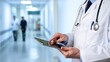 © Md Abu Saeid - Doctor in a hospital hallway using a digital tablet for modern medical practice, doctor, physician, medical, healthcare, hospital, tablet, technology, modern, digital, electronic, patient care, hallwa