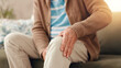 © peopleimages.com - Senior man, sofa and knee pain with injury for chronic illness, arthritis or fibromyalgia at home. Closeup, elderly or male person with sore leg, accident or medical emergency for joint inflammation