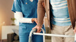 © Claytonon/peopleimages.com - Nurse, help and elderly patient with walker for assisted living, mobility or healthcare at house. People, hands and caregiver aiding senior person with a disabiliy for movement, recovery or walking