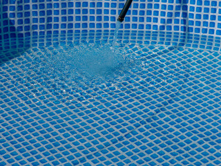 Poster - A pool is being filled with water