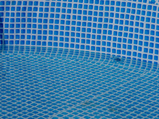 Poster - A blue and white swimming pool with a blue tarp