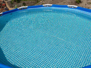 Poster - A blue swimming pool with a blue tile floor