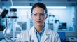 © Zeeshan Sharfi - Female scientist researcher in lab coat working in laboratory research and development science industry