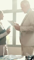 Poster - Agreement, people and handshake for client in office, woman and meeting for partnership or teamwork. Happy, employee and shaking hands with man for investment, documents and collaboration for project