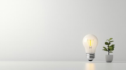 Poster - A simple minimalist smart light bulb glowing on a neutral colored surface accompanied by a small potted plant creating a clean and inspiring work or home environment