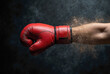 © Ryan Rizky Pratama - Red Boxing Glove Punch Impact with Flying Dust and Debris on Dark Background