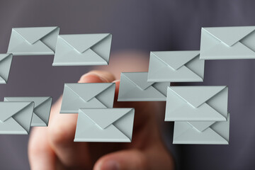 Fototapete - A hand interacts with numerous digital email envelopes, illustrating inbox management challenges.