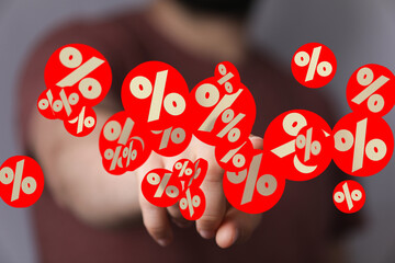 Poster - Abstract image of percentage symbols floating around a hand, symbolizing discounts, sales, or financial growth.