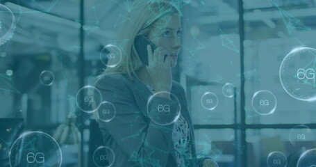 Poster - Image of data processing over caucasian businesswoman talking on smartphone in office