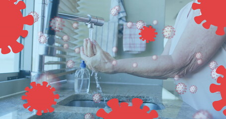 Poster - Image of covid 19 cells over senior caucasian woman washing her hands