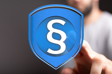 Poster - Secure legal protection concept.  Digital shield with paragraph symbol.