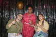 © Seventyfour - Multiethnic group of young adults celebrating birthday, smiling and holding glasses in front of metallic backdrop, Caucasian man with disability in wheelchair joining Black woman and Caucasian woman