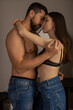 © zinkevych - Woman embracing her man in house couple sharing passionate kiss