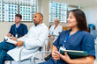 © unai - Medical team attending conference in hospital meeting room