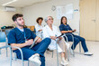 © unai - Medical team attending conference in hospital meeting room