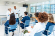 © unai - Medical team attending conference in hospital meeting room