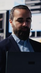 Poster - Vertical Video Male public speaker and business coach leading a dynamic presentation with a live audience. Sharing strategy, growth ideas and financial forecasting in a tech driven business event