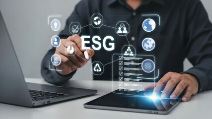Aufkleber - Man using a pen on a tablet with esg icons and laptop on desk in a corporate setting for business