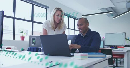 Poster - Male analyst gesturing toward laptop, guiding female manager typing for collaborative data analysis