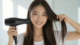 Young Woman Drying Hair with Hair Dryer and Smiling