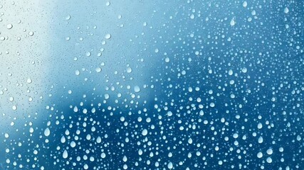 Poster - Abstract shot of water droplets on glass forming pattern with various sized clear translucent circles against graded light blue background.