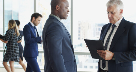 Poster - Business, colleagues and men with document, meeting and ceo with financial report, team or proposal. Office, collaboration and people with file for stock market, reading and opportunity for investor
